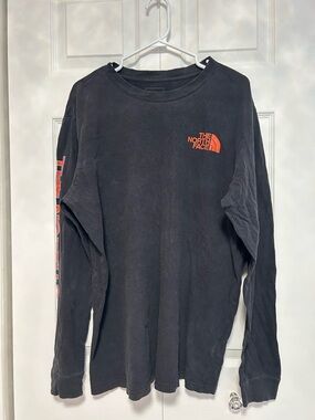 The North Face Black Long-Sleeve Shirt with Orange Logo and Sleeve Text